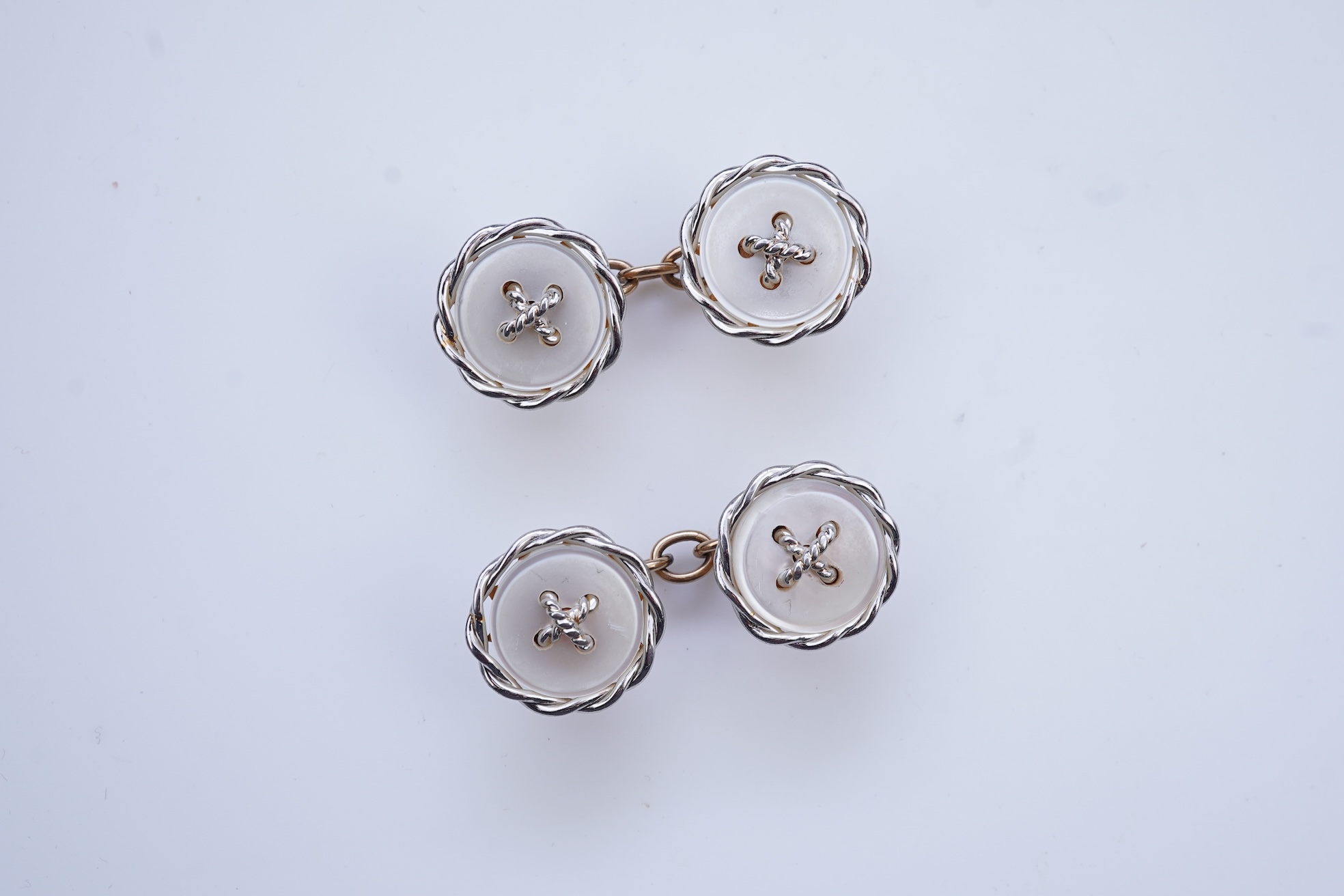 A pair of mother of pearl cufflinks, early 20th century